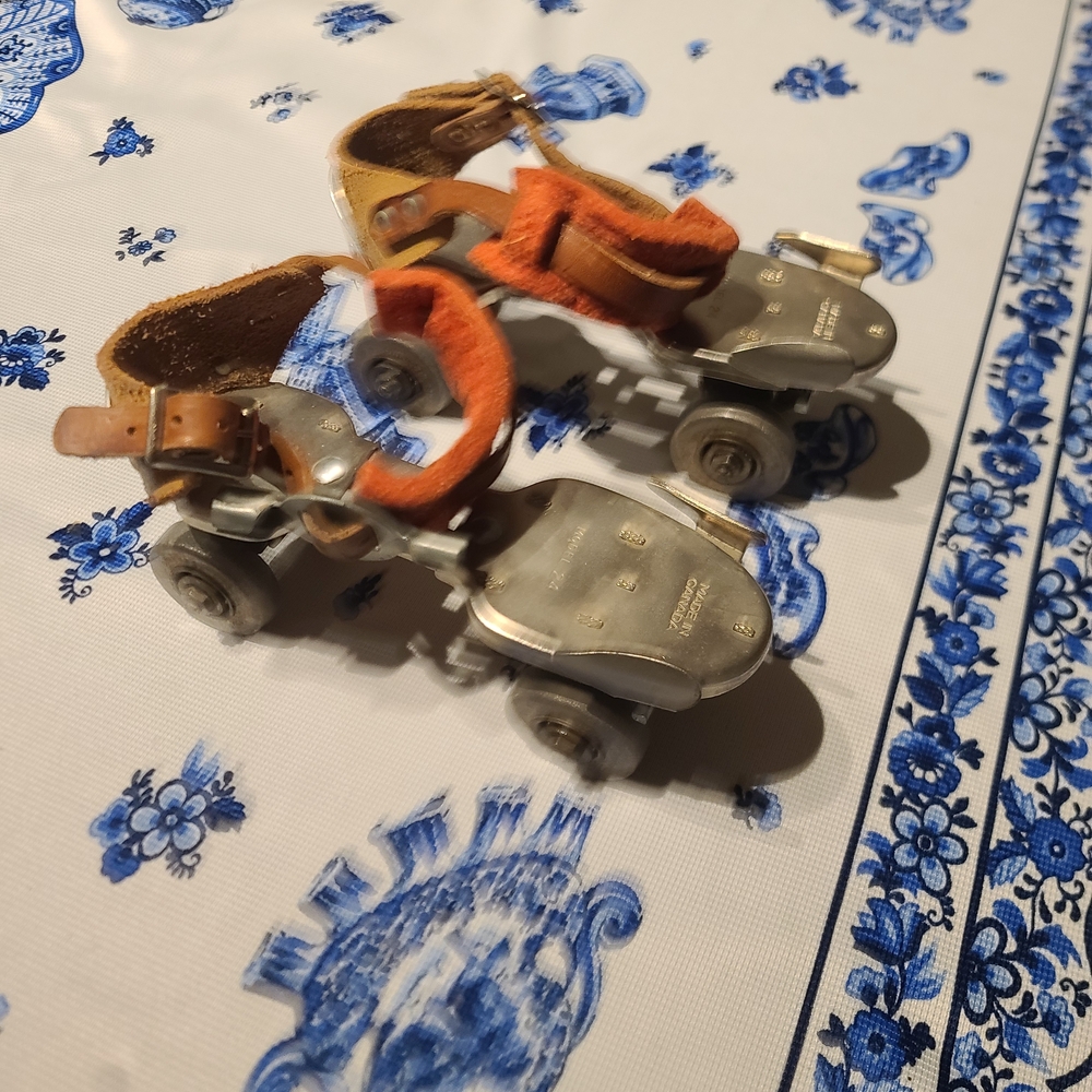 Classic Metal Roller Skates with Orange and Brown Straps